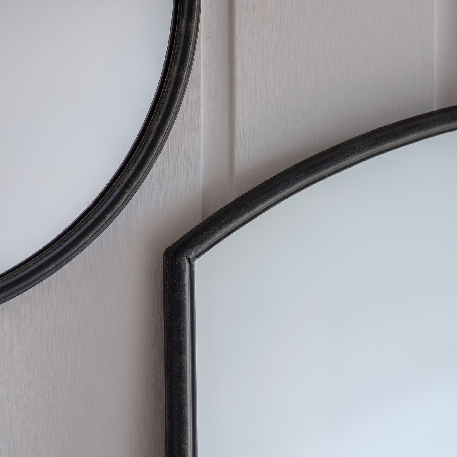 Chic small window mirror in black frame with curved design