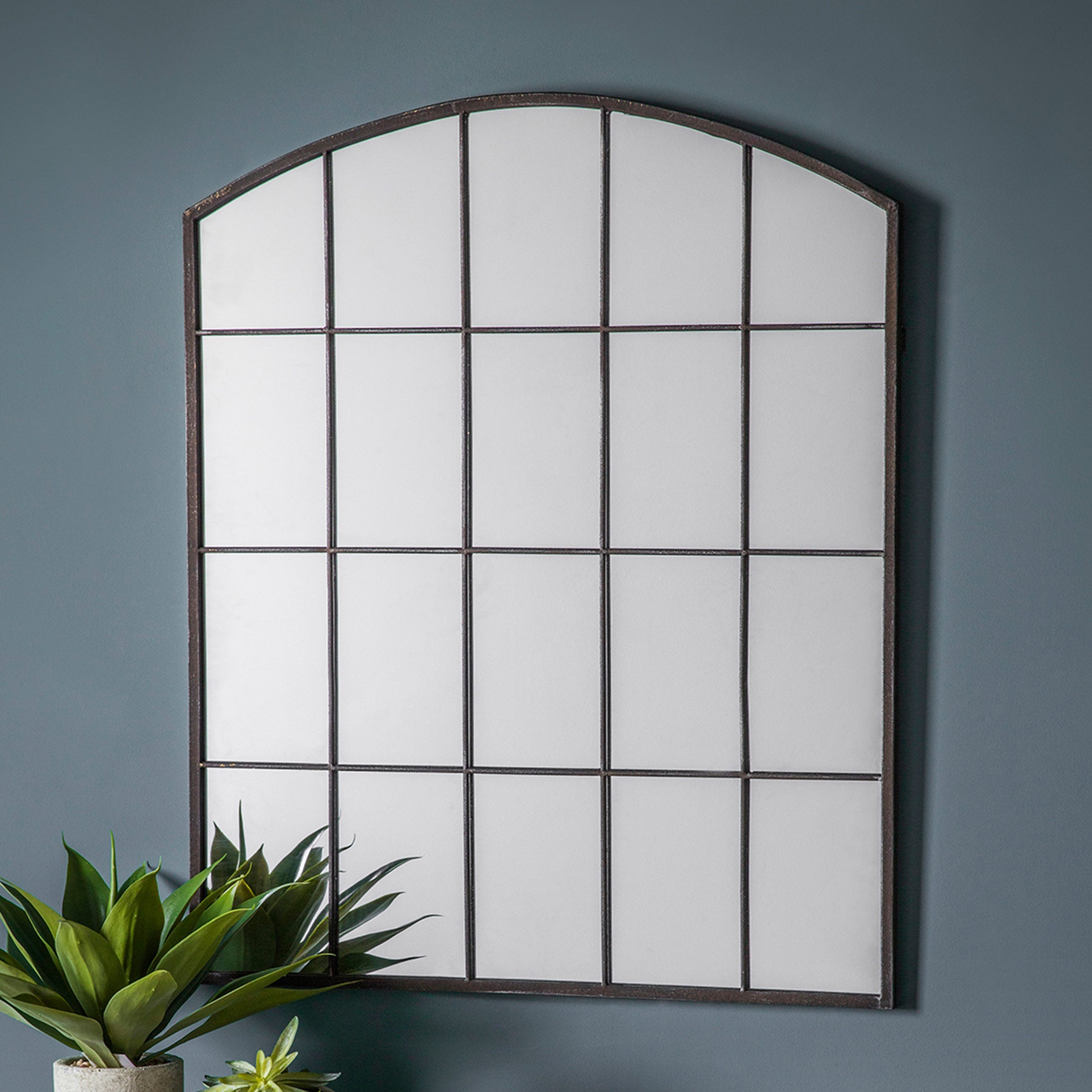 Elegant curved window mirror with arched design and sleek black frame