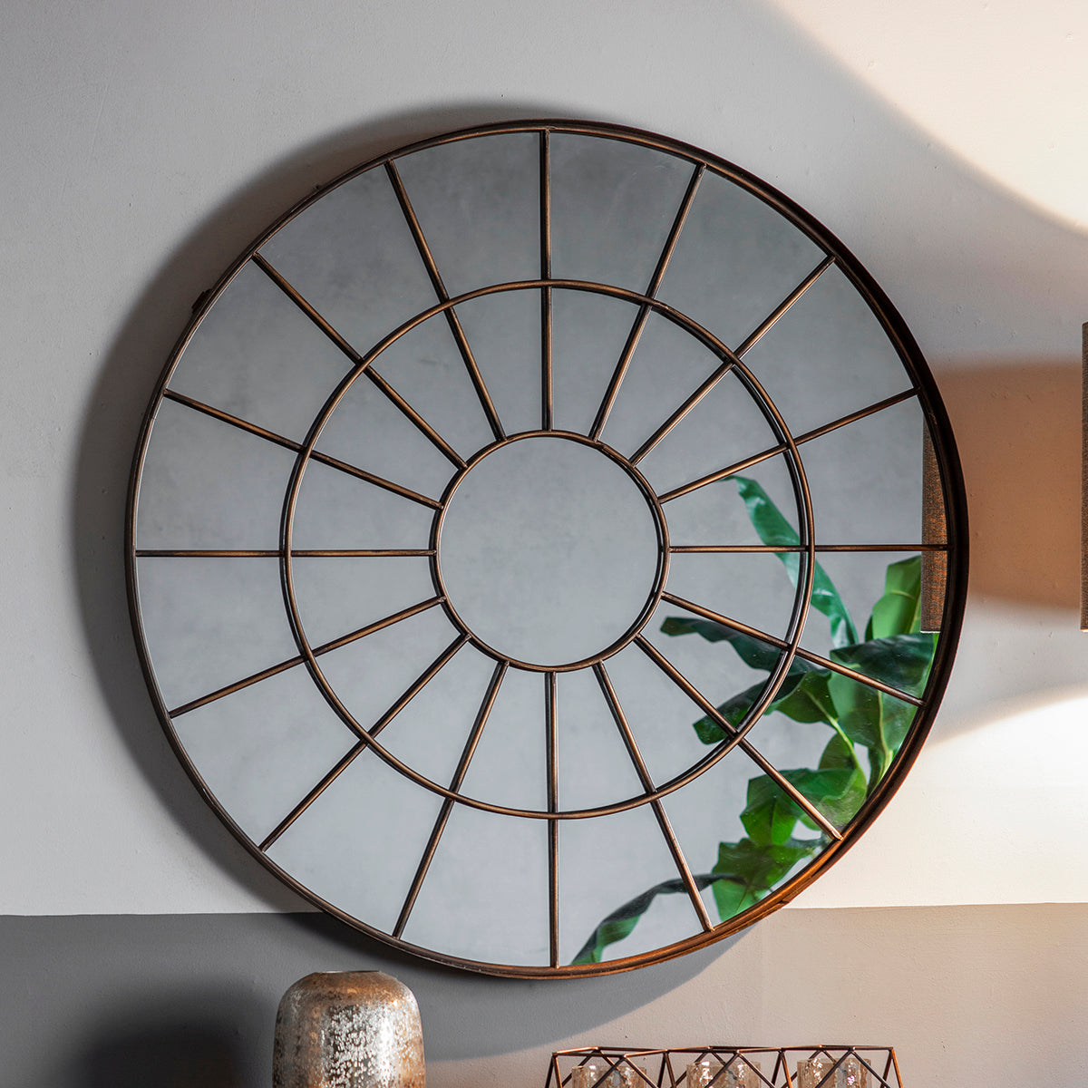 Bronze effect metal frame circular mirror with intricate web design
