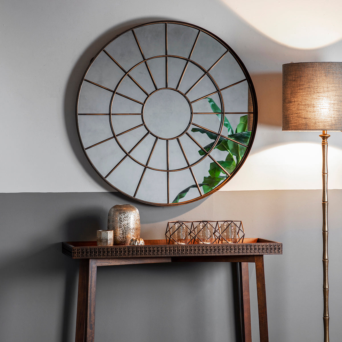 Bronze effect metal frame circular mirror with intricate web design