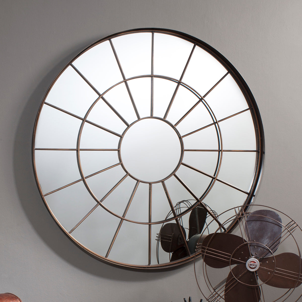 Bronze effect metal frame circular mirror with intricate web design
