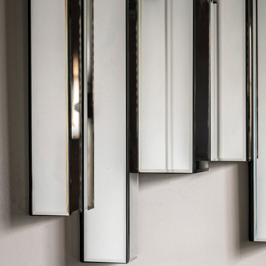 Modern wall mirror with abstract bevelled panelling