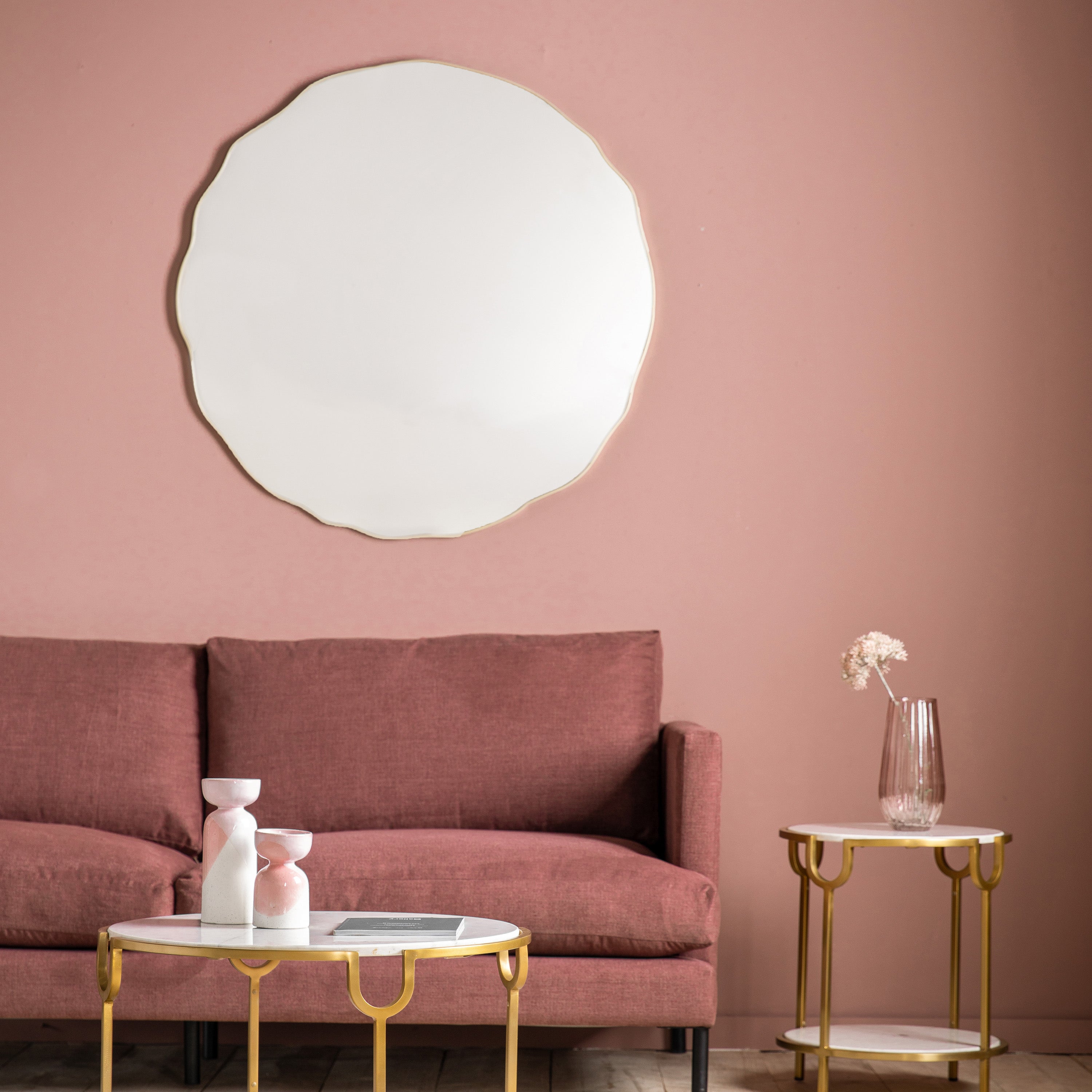 Round wavy edge mirror in champagne finish and bevelled edge