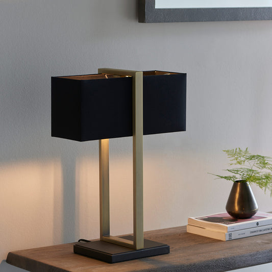 Modern table lamp with matt black base, antique brass finished frame and black cotton shade