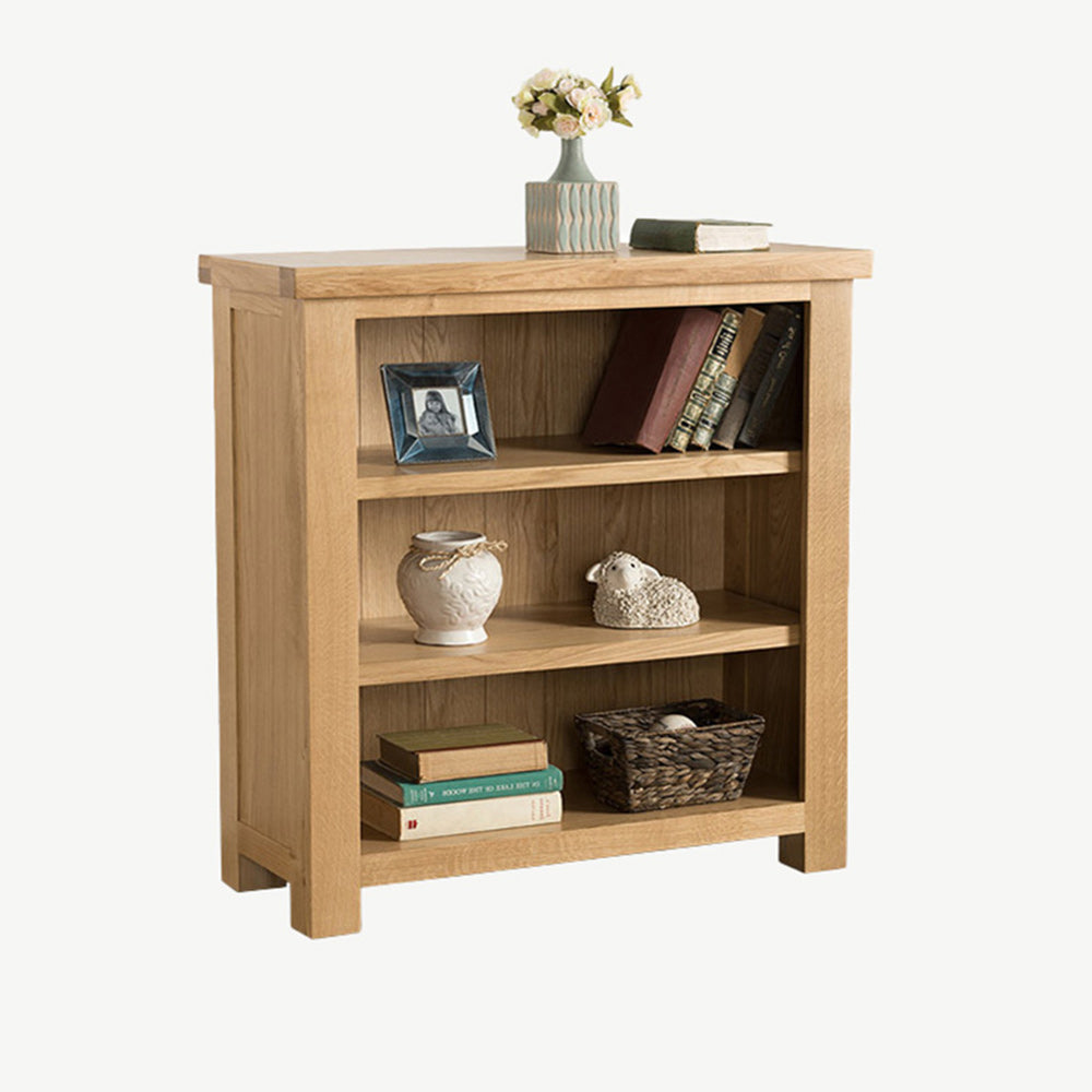 Oak low bookcase in natural finish with three shelves
