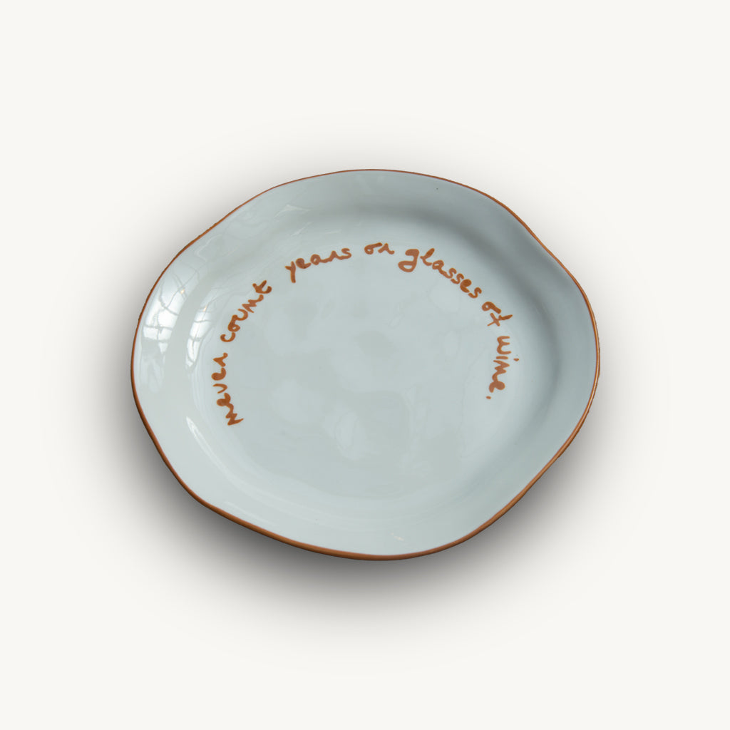 "Never count years or glasses of wine" Orange Decorative Plate