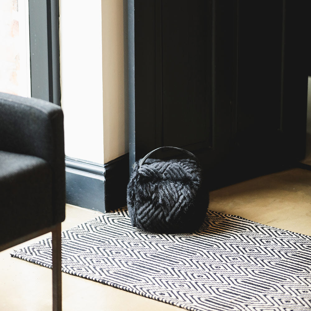 Plush Faux Fur Door Stop in Jet
