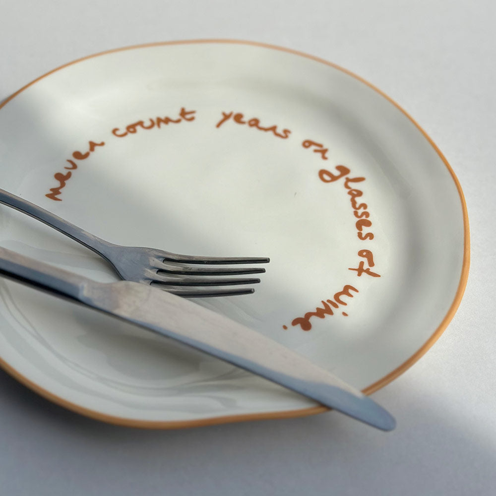 "Never count years or glasses of wine" Orange Decorative Plate