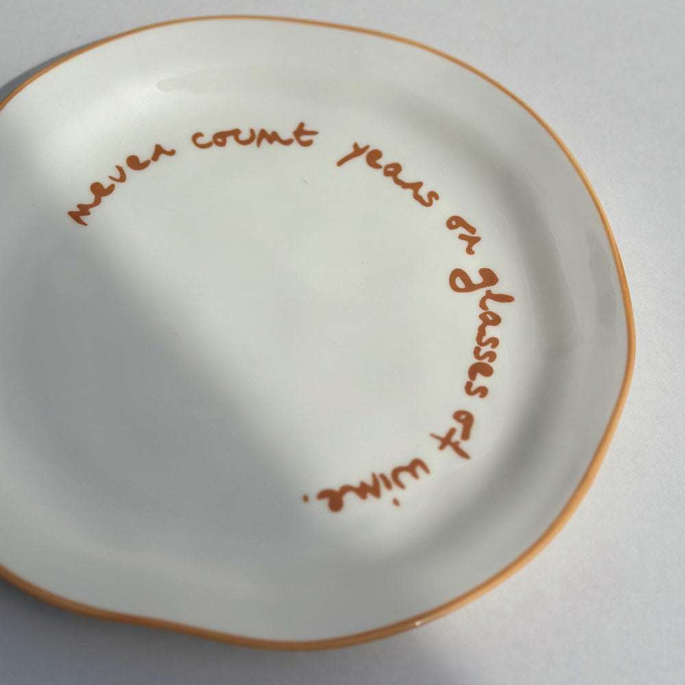 "Never count years or glasses of wine" Orange Decorative Plate