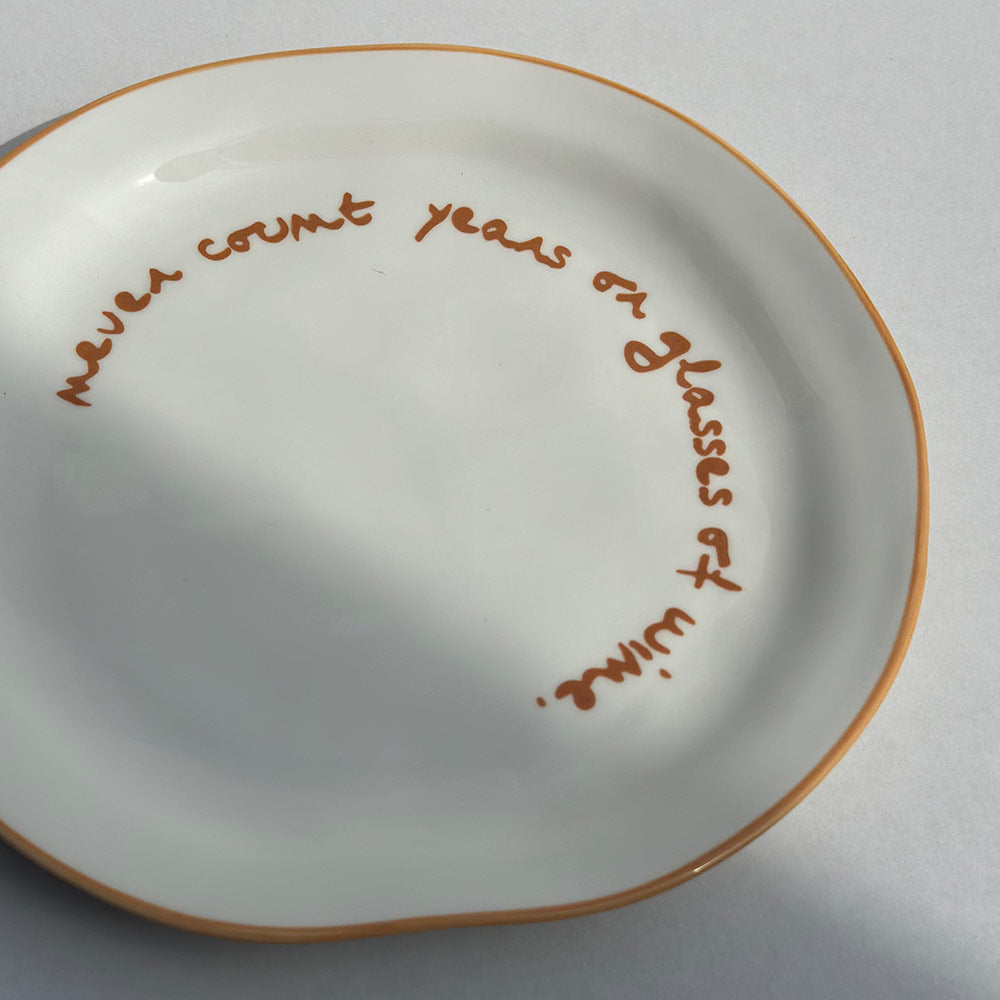 "Never count years or glasses of wine" Orange Decorative Plate