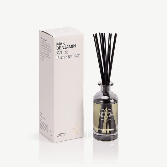 White pomegranate diffuser in smoke gladd with matching diffuser sticks