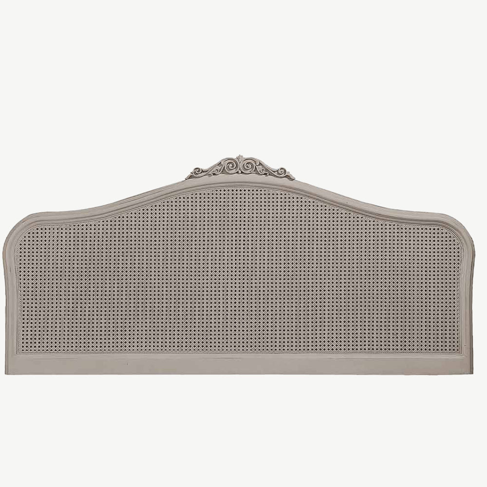Chic grey rattan headboard with intricate detailing
