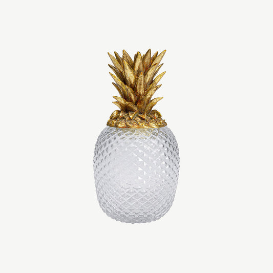 Decorative container in the shape of a pineapple with a gold-coloured lid and transparent body