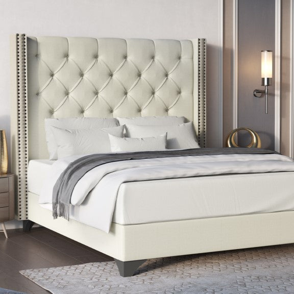 Cream upholstered bedframe with studded headboard and grey feet