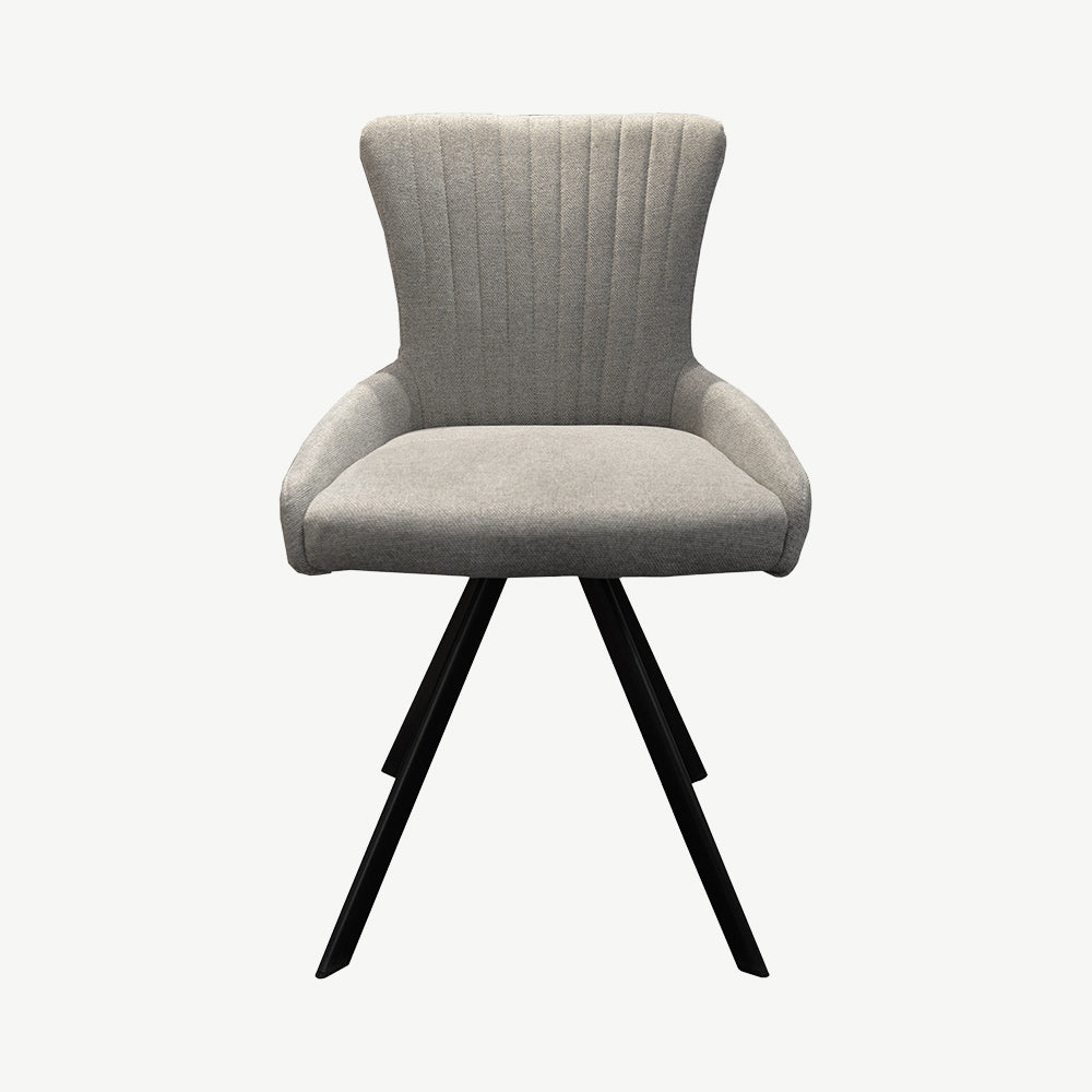 Sleek dining chair upholstered in a light grey ribbed fabric and black legs