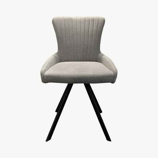 Sleek dining chair upholstered in a light grey ribbed fabric and black legs
