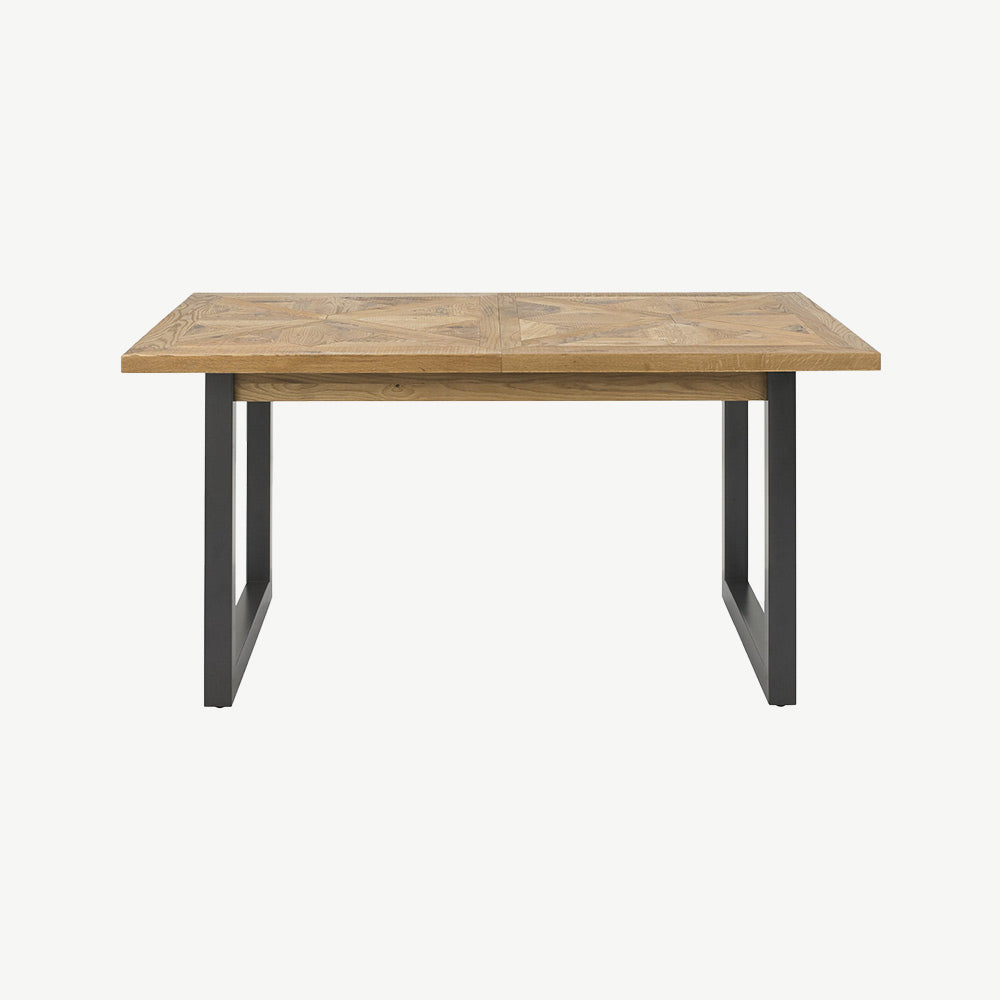 Oak veneer extending dining table with black powder coated metal base
