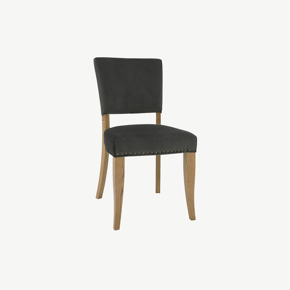 Dining chair upholstered in black velvet with wooden legs