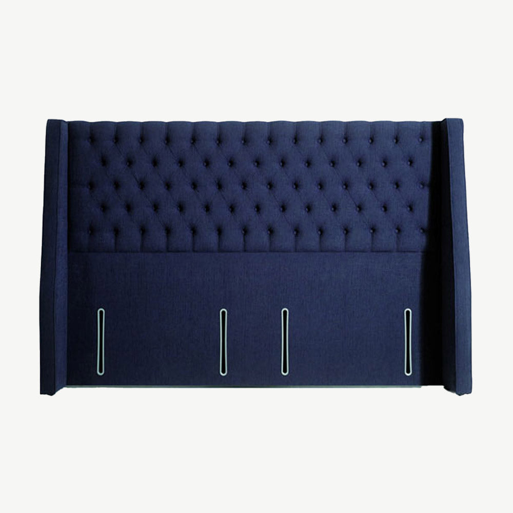 Winged navy headboard with deep set button detailing