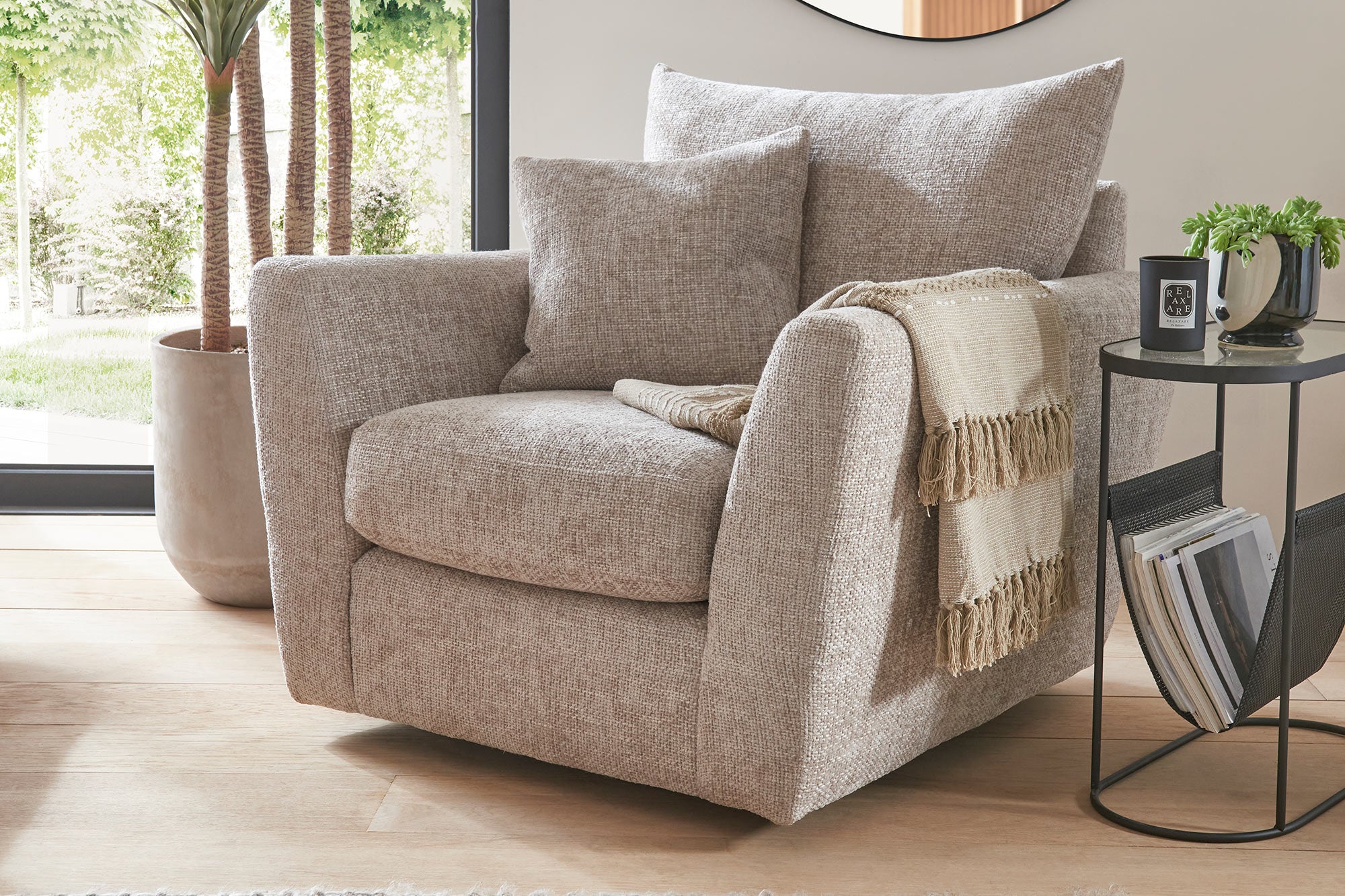 Queens Swivel Chair Lifestyle in Pole-Pumice Lux-Kingfisher Lux-Slate-Black Pole-Dove