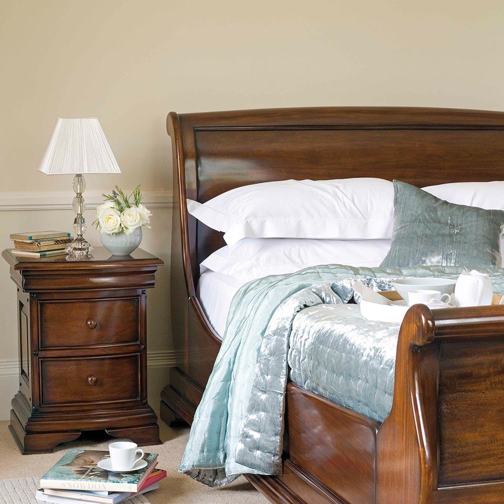 French inspired wooden bedframe with high footboard in glossy varnished dark brown finish