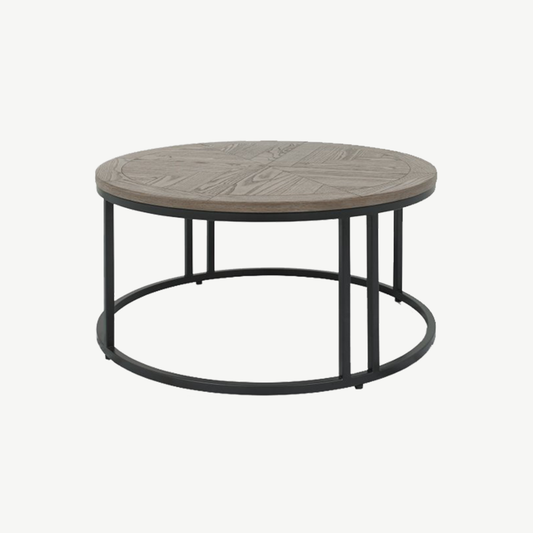 Wooden coffee table with saw-cut ash chevron pattern in silver grey finish and black powder coated metal base