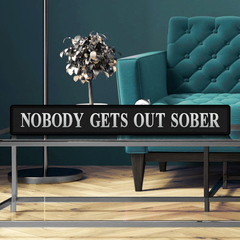 Nobody gets out sober street sign